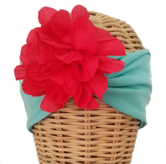Banda Hawai. Banda elástica en color turquesa con flor lateral en color coral : PVP 35 euros